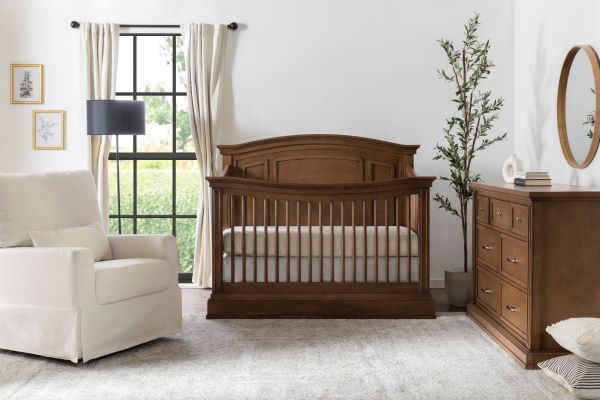 Durham 4-in-1 Convertible Crib in Derby Brown in nursery room with Durham dresser and Crawford glider