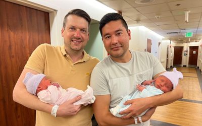 Chris (left) and Bryan (right) with their twins, Brecon and London